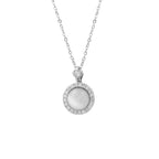 A silver pendant necklace featuring a round white mother-of-pearl center stone surrounded by a halo of small clear stones, suspended from a delicate silver chain on a white background.