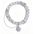A clear crystal beaded bracelet with silver-toned chain and snowflake charms, displayed on a clean white background.