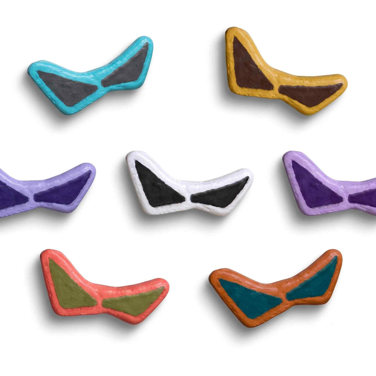 Six small Mini Magnetic Sunglasses accessories in assorted colors, including turquoise, mustard yellow, purple, white, coral pink, and orange, arranged on a plain white background.