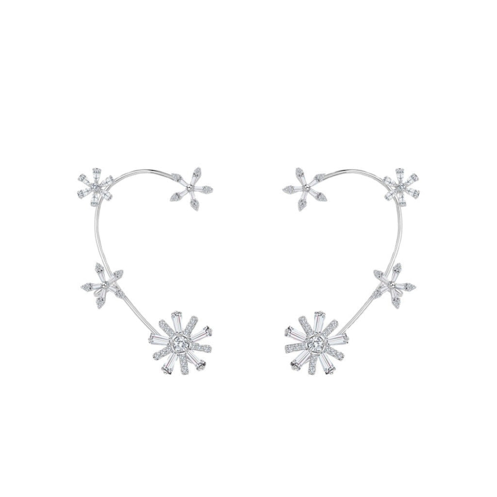 Silver snowflake earrings on a white background
