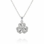 A silver-tone flower pendant necklace with a central clear gemstone and small pavé-set stones, suspended on a delicate chain against a white background.