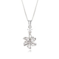 A silver-tone flower pendant necklace on a delicate box chain, featuring clear cubic zirconia stones in a starburst flower design with a small star accent above it, set against a plain white background.